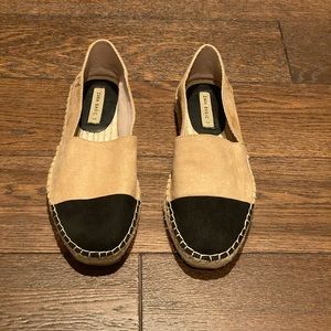 Tan and black slip on loafers